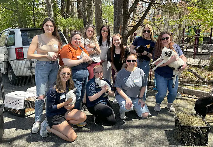 Group picture of staff at petting farm sensory event