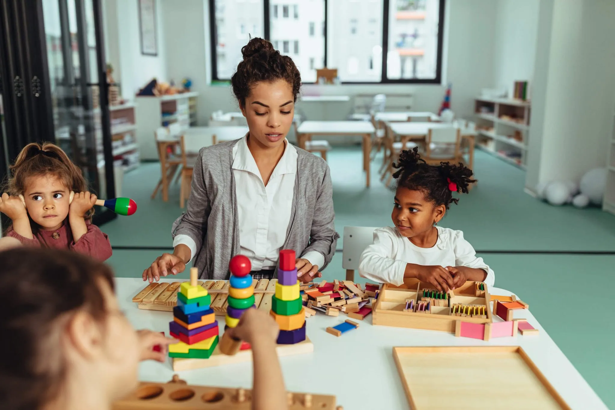 Therapist and child at a table playing