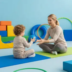 Child and therapist playing with a sensory ball during therapy at Bierman Autism Centers.